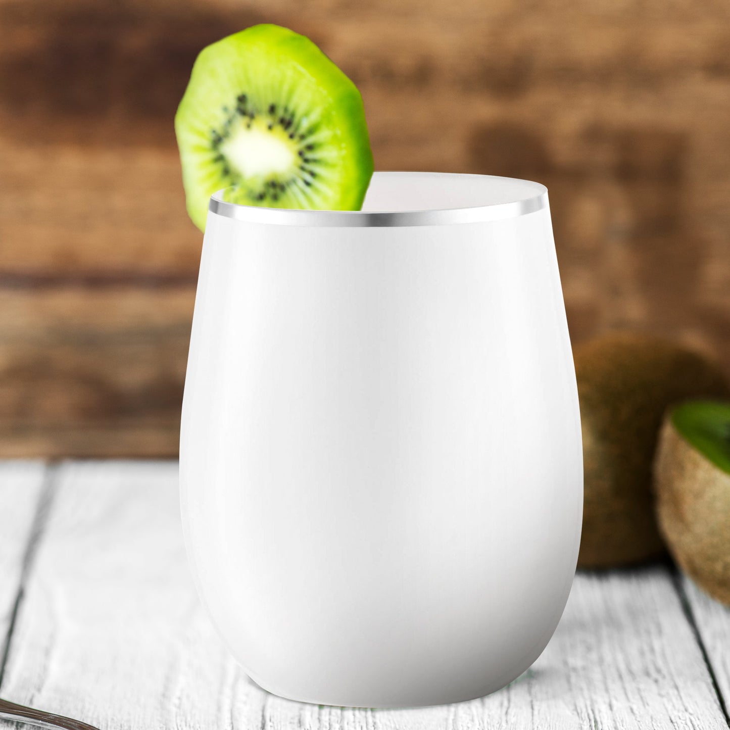 12 oz. White with Silver Elegant Stemless Plastic Wine Glass decorated with a kiwi slice, showcasing its refined style