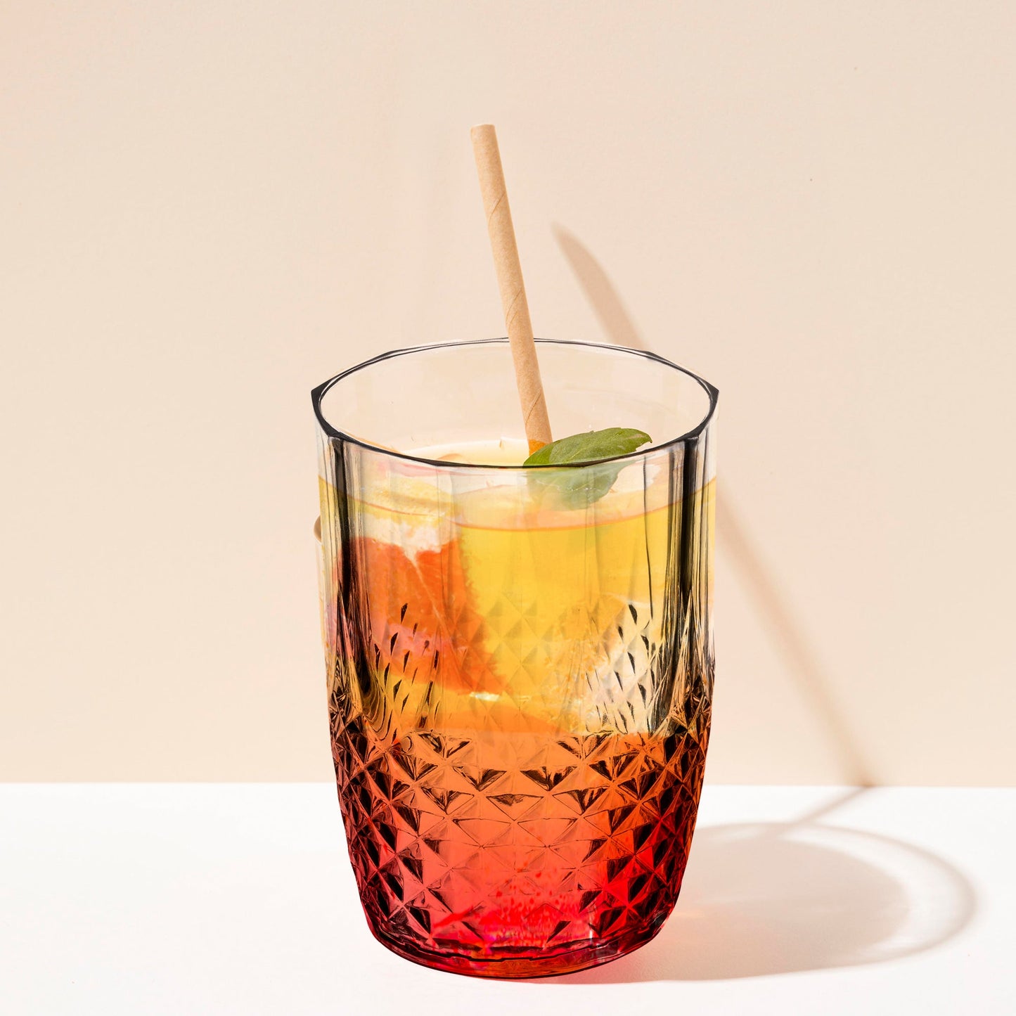 16 oz. tumblers with clear stripes presented on a cocktail station, perfect for serving iced drinks