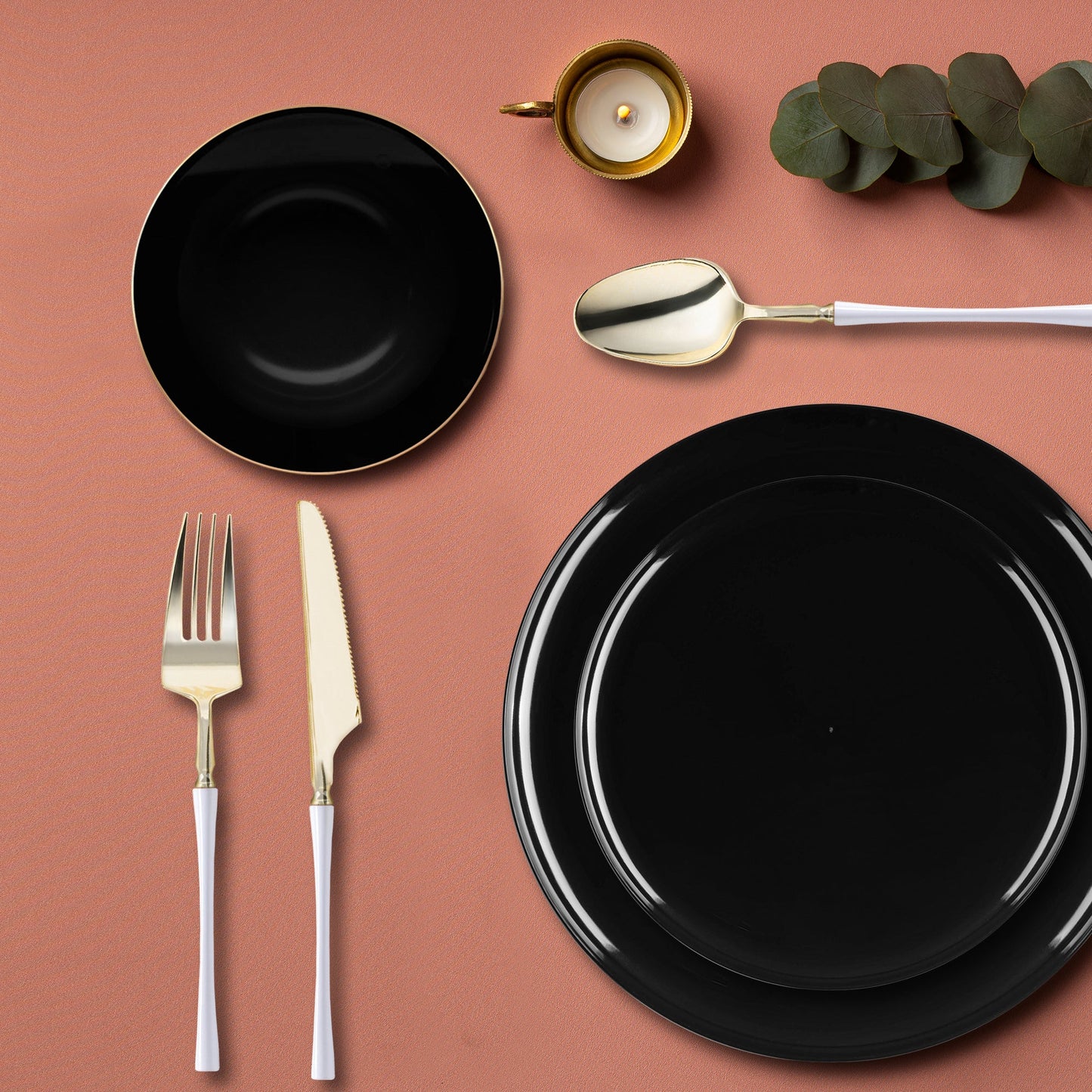 Black Flat Round Disposable Plastic Tableware Set styled with gold accents for a formal dinner.