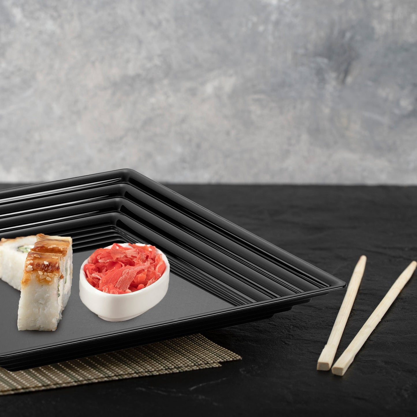 Black Square Serving Trays with groove rims held hors d'oeuvres at an upscale reception.
