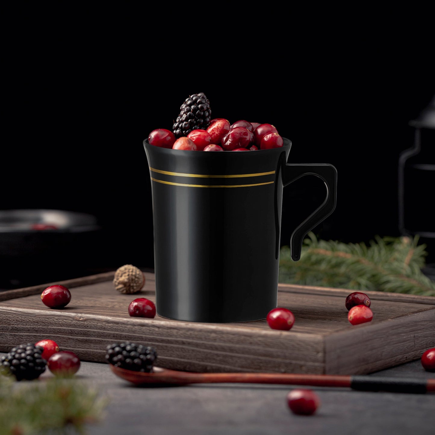 Black plastic coffee mugs with gold edge detail used in a chic coffee setup for a reception event