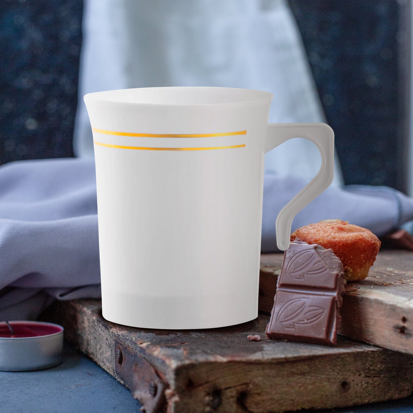 Chic table setup featuring 8 oz. White with Gold Edge Rim Round Plastic Coffee Mugs filled with colorful beverages and surrounded by decor