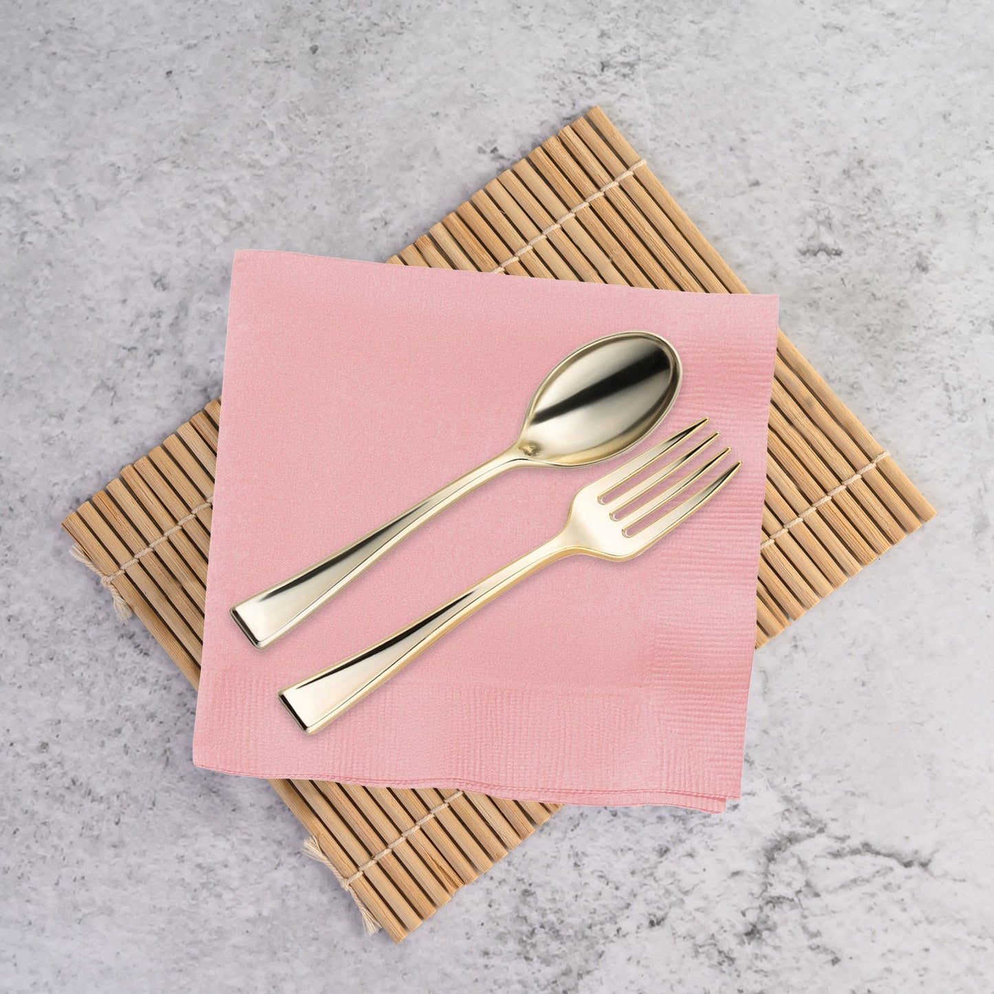 Classic pink disposable napkins for cocktails and beverages, measuring 10 by 10 inches when unfolded; sold in a 600-count pack