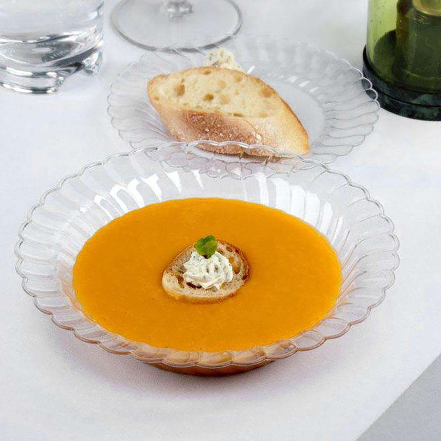 Clear plastic soup bowls with a flared edge design, 12 oz., in a bulk pack of 180, ideal for events and parties