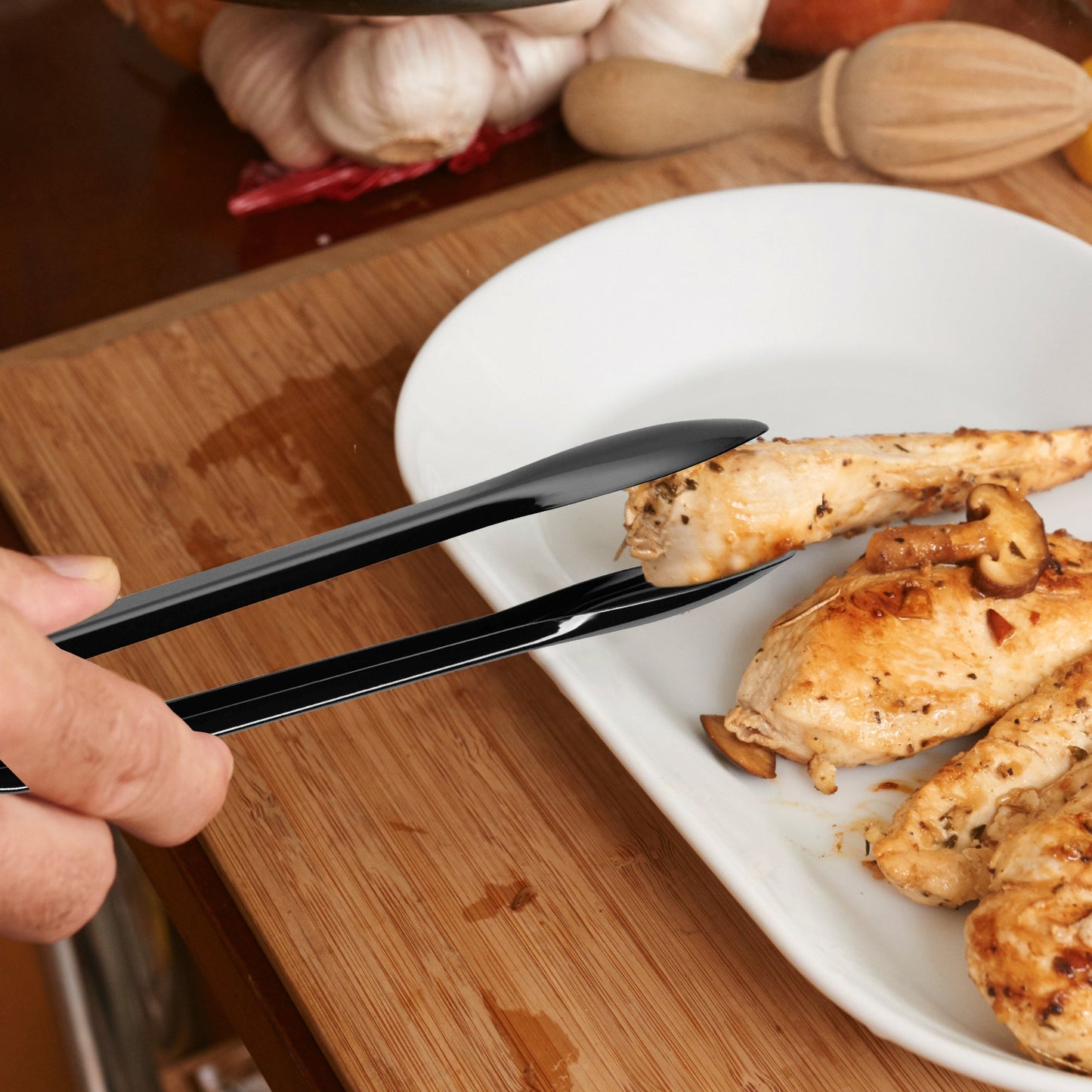 Disposable plastic tongs offered reach and control at buffet stations.