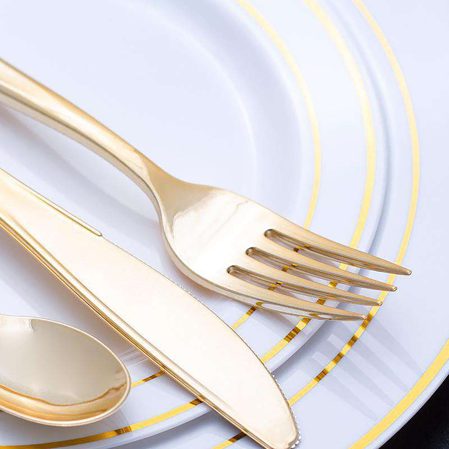 Disposable shiny metallic gold plastic spoons, 6.25 inches, single-use yet sturdy, great for easy cleanup at events.