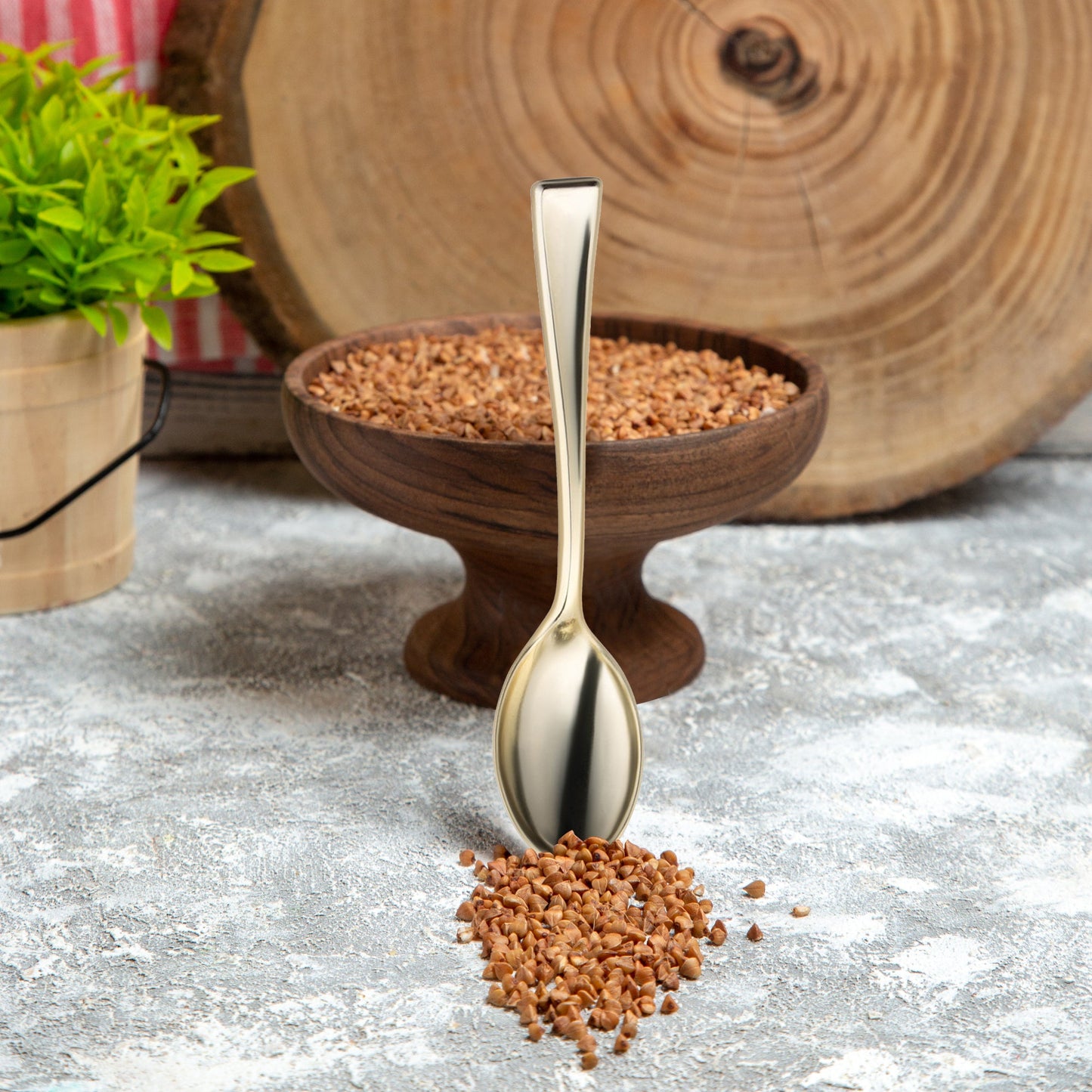 Durable 4-inch gold mini plastic tasting spoon, lightweight and stylish for elegant food presentation.