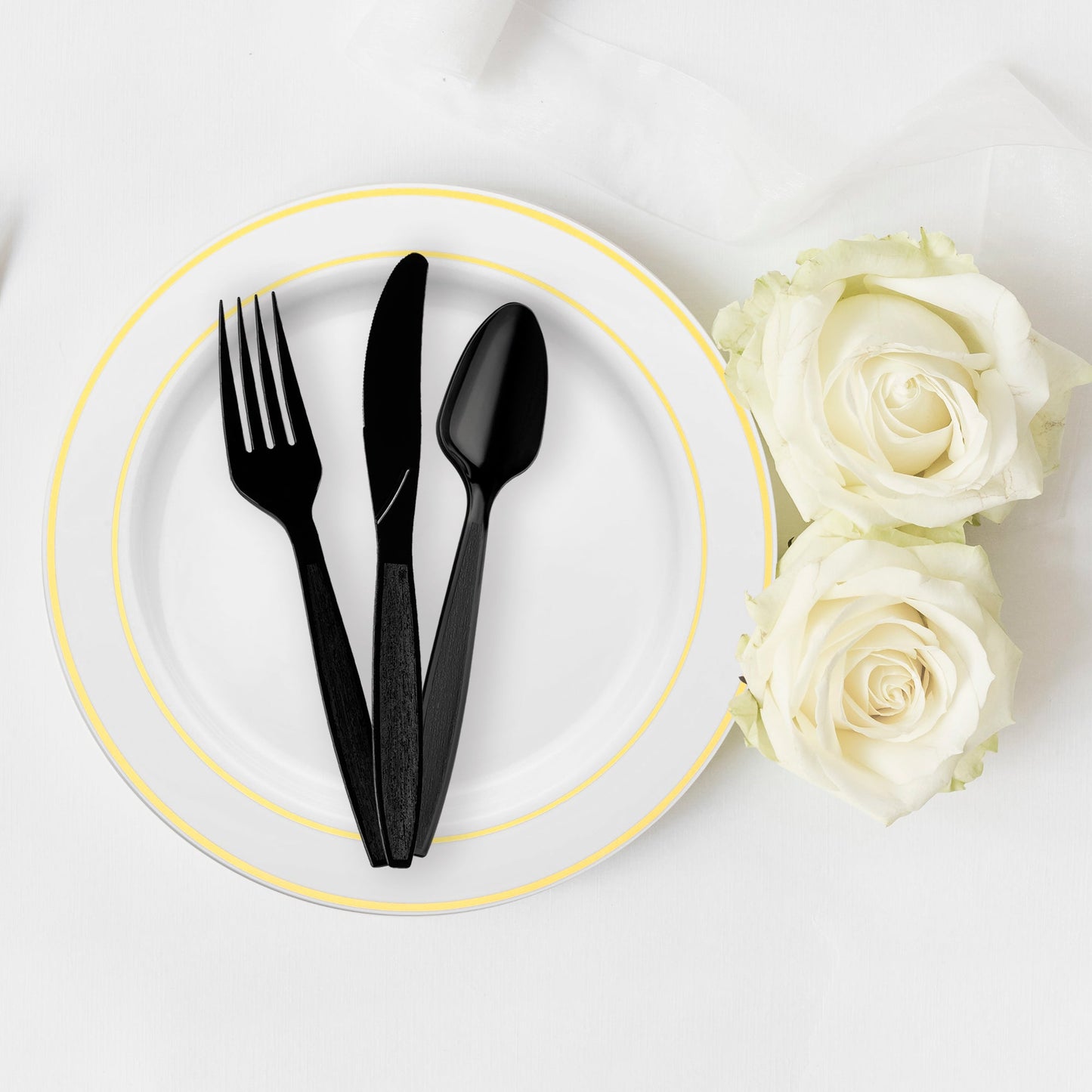 Durable black plastic spoons, 6 inches in length, strong enough for soups, desserts, and main courses.
