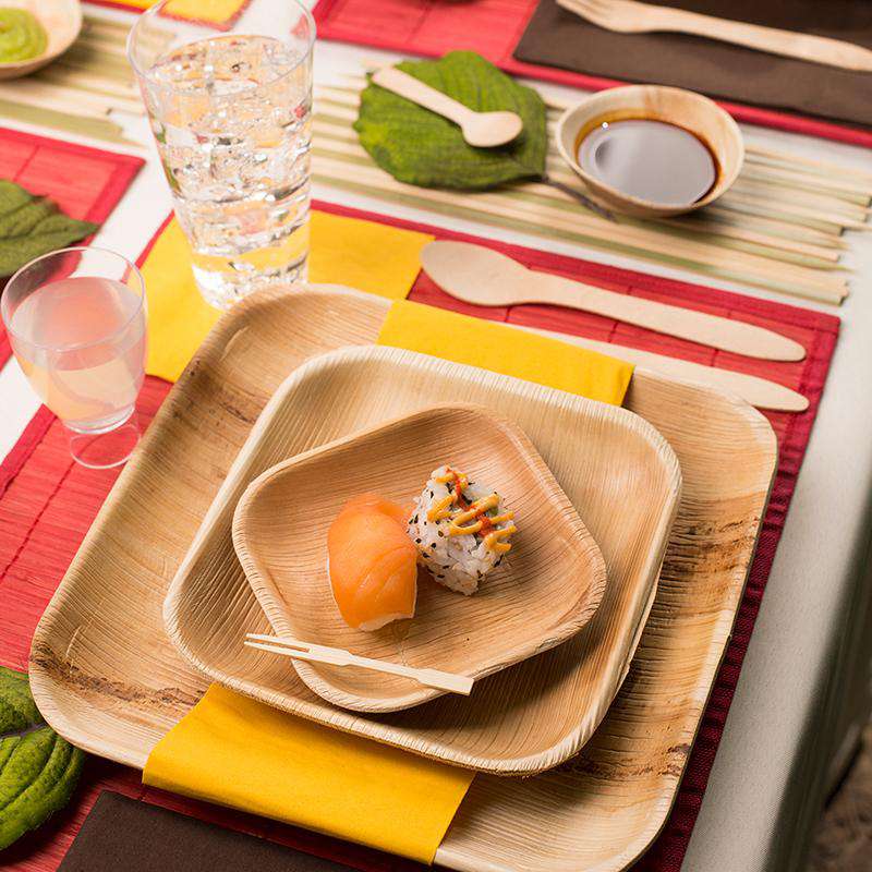 Elegant 7-inch square disposable plates made from natural palm leaf, perfect for appetizers or salads