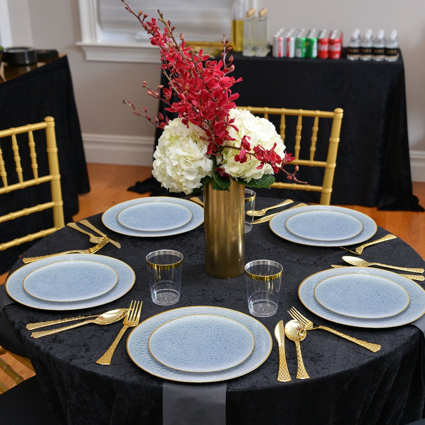 Entrees were served on 10.25" hammered plates with gold detail during a coastal celebration.