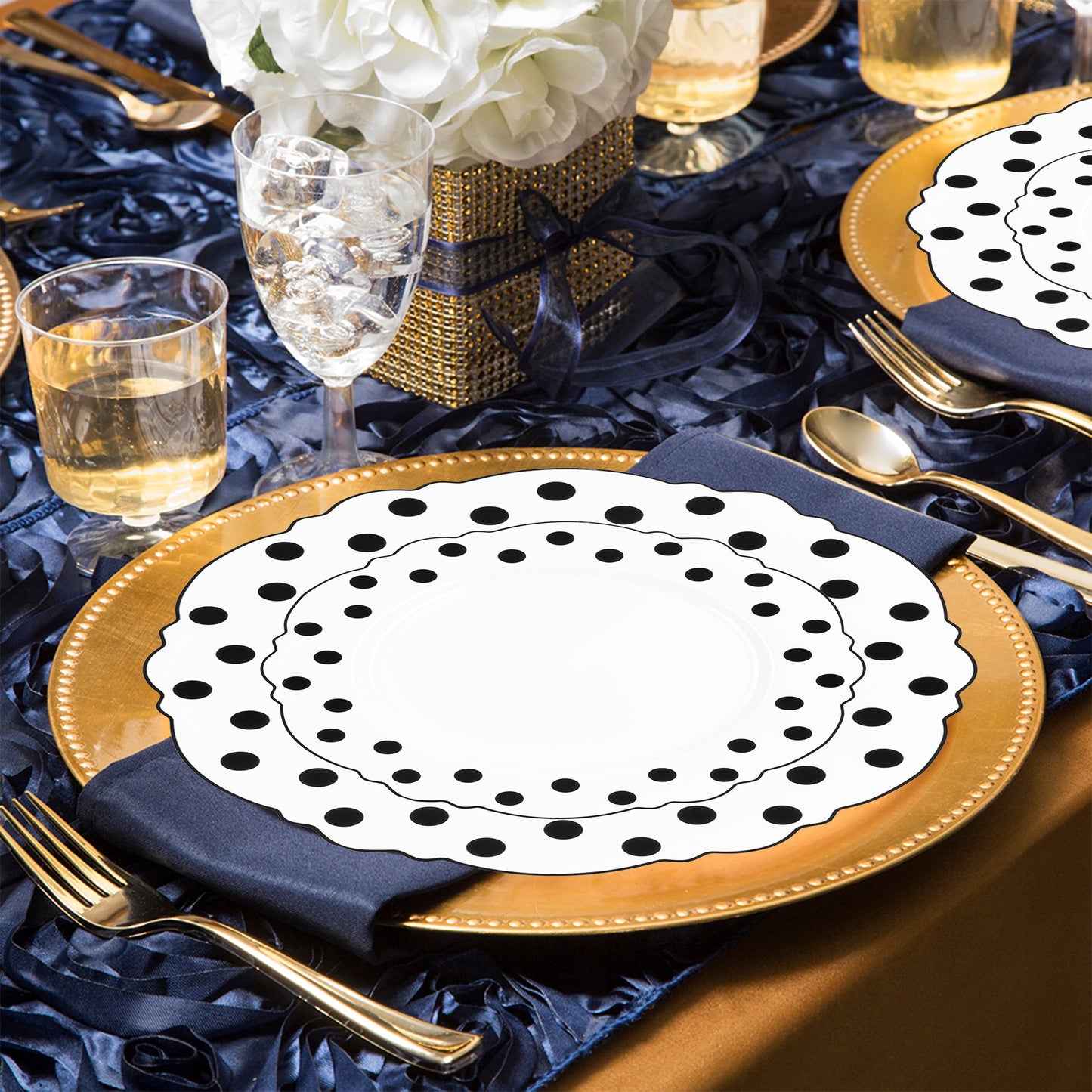 Every item in the White with Black Dots Round Blossom Disposable Plastic Wedding Value Set is included, ensuring a complete and chic table arrangement for your event