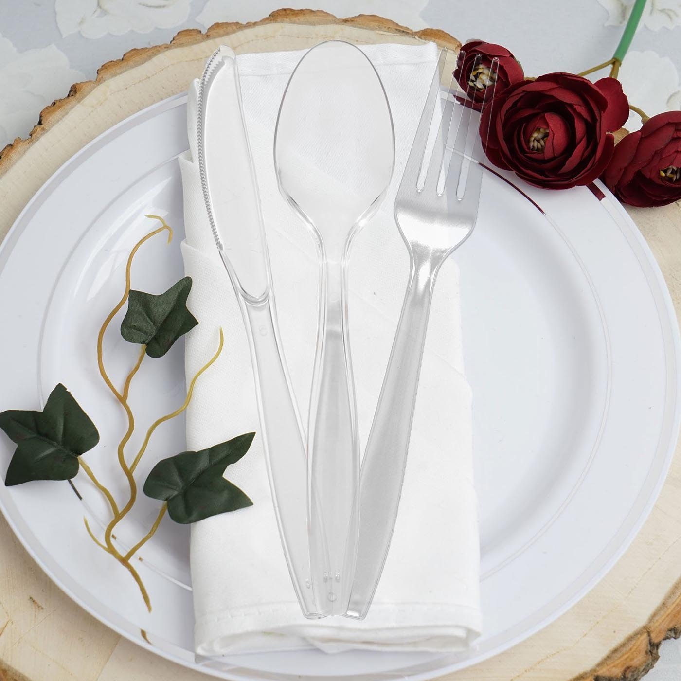 Fancy clear plastic spoons with a sleek design, ideal for upscale events and celebrations