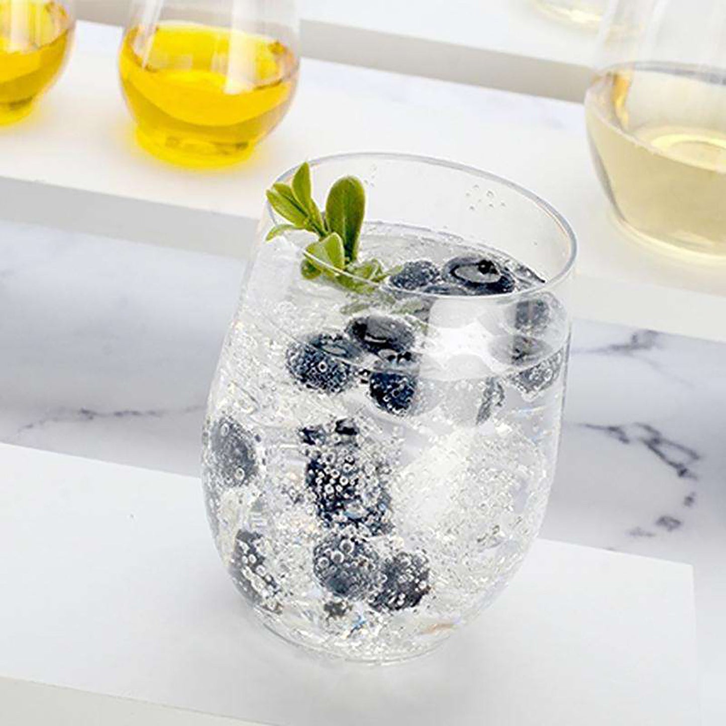Fancy clear plastic wine glasses with a stemless design, 16 oz size, disposable for easy cleanup; 64-pack