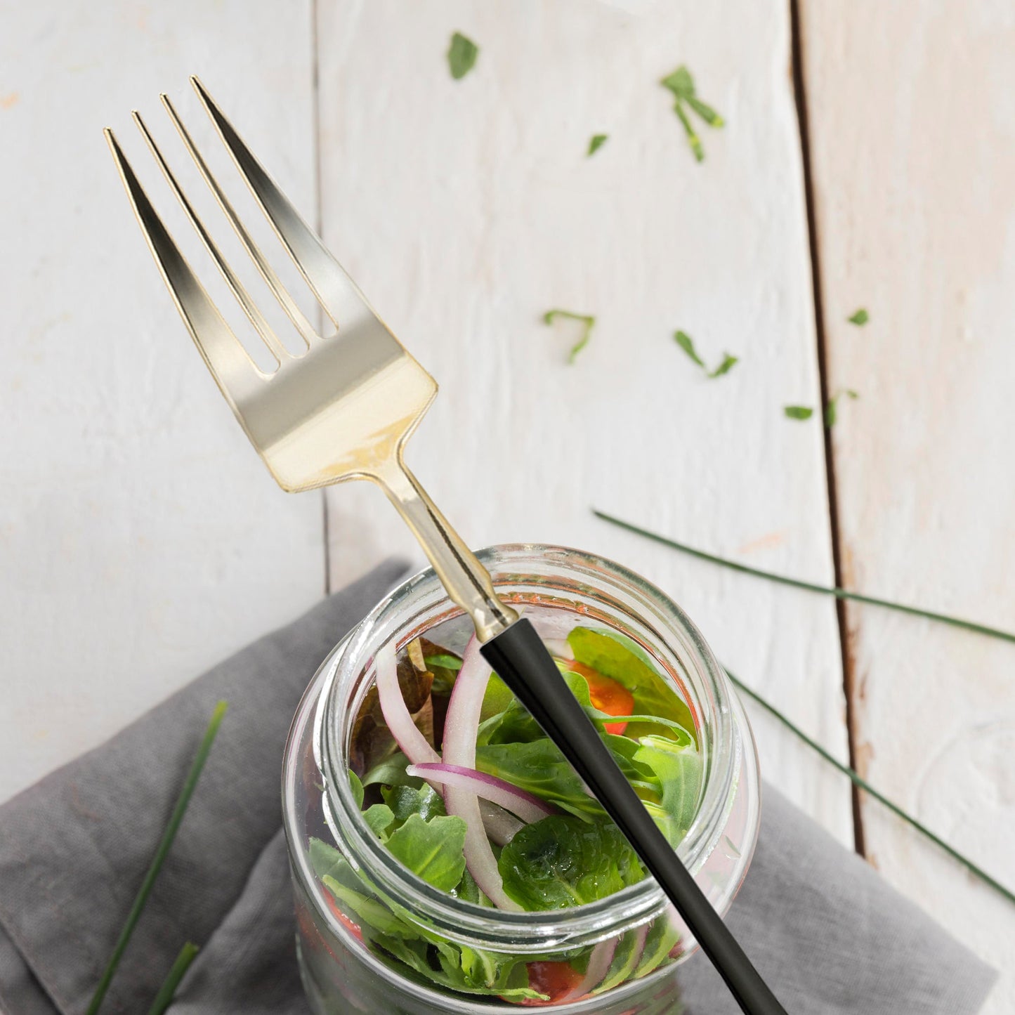 Gold with Black Handle Moderno Disposable Plastic Dinner Forks ideal for serving meals in both indoor and outdoor settings