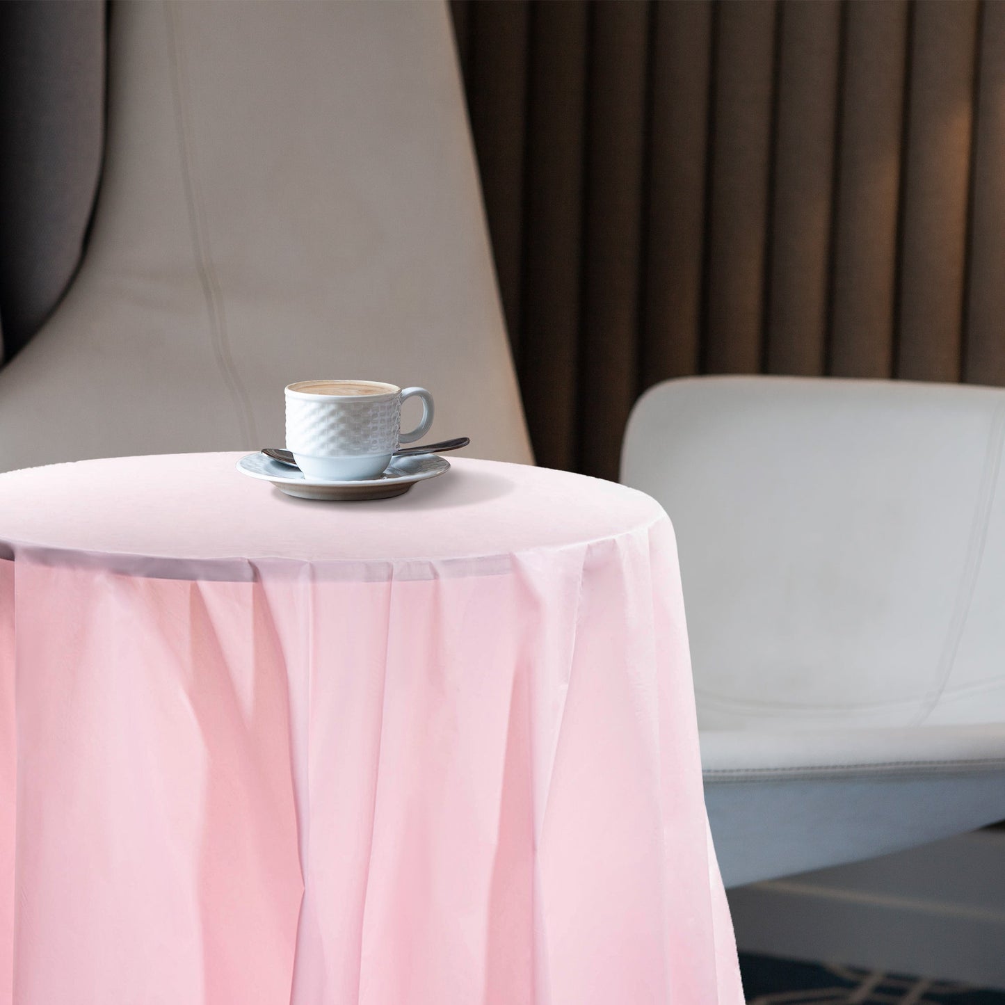 Guests dined on tables covered with 84" pink plastic cloths for a soft festive touch.