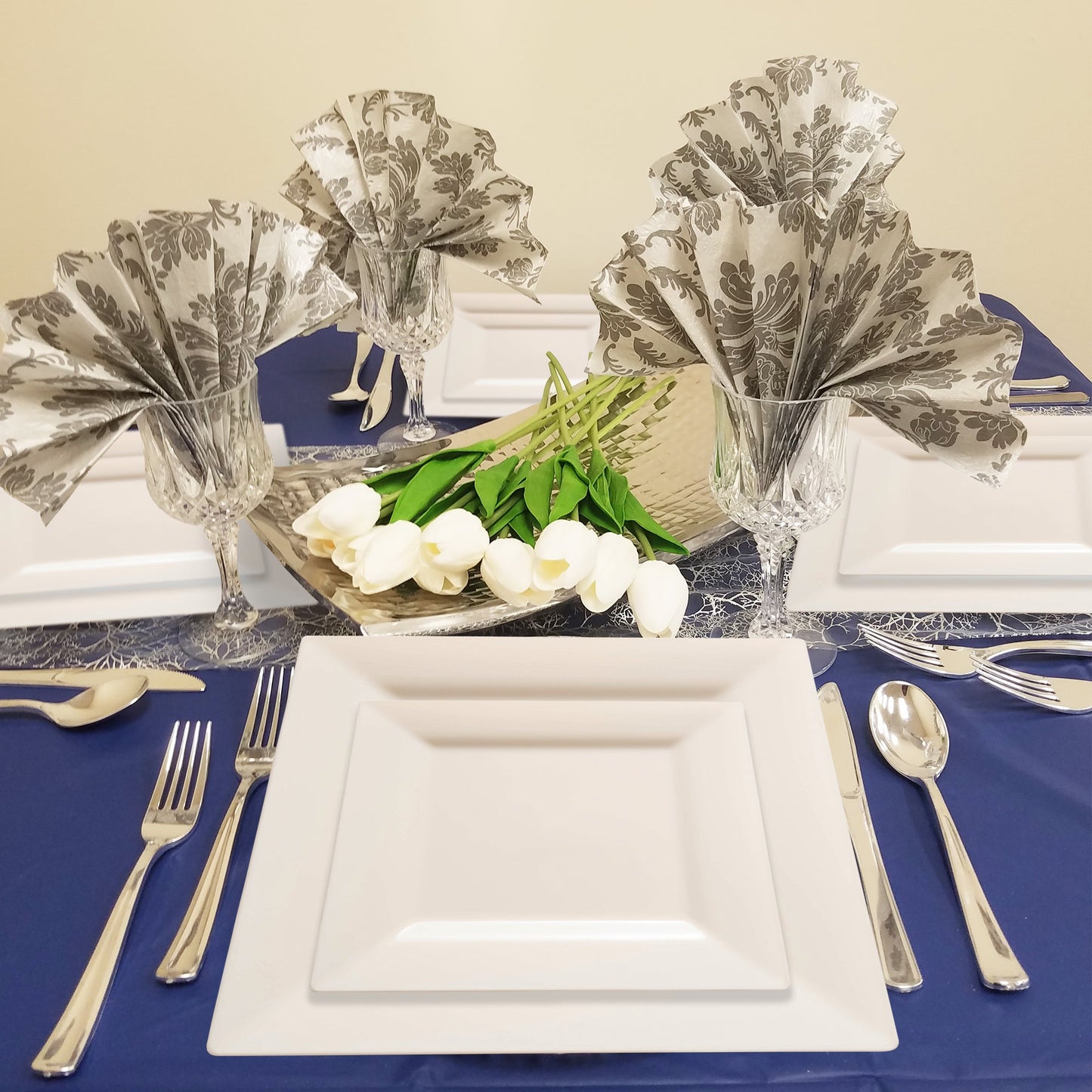Guests enjoyed cake on 6.5" ivory plates during a romantic, candlelit event