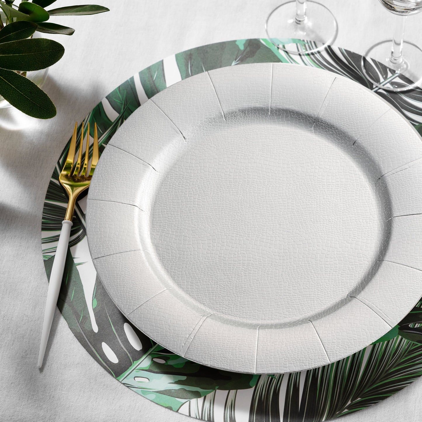 Silver Round Charger Plates (13") enhance the look of a formal dining table with floral decor and linen detail