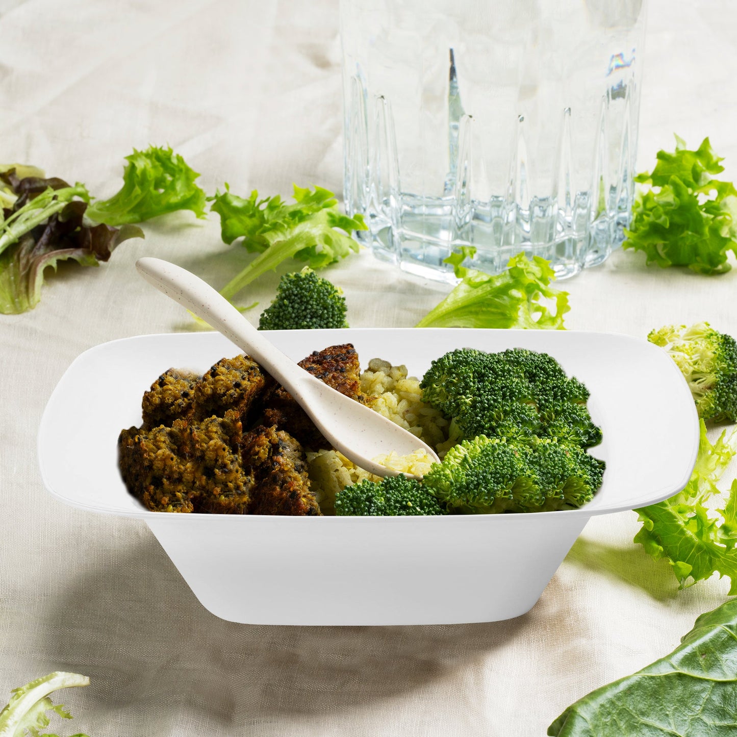 Solid White Rounded Square Disposable Plastic Dessert Bowl (5 oz.) filled with savory meat, fluffy rice, and steamed broccoli