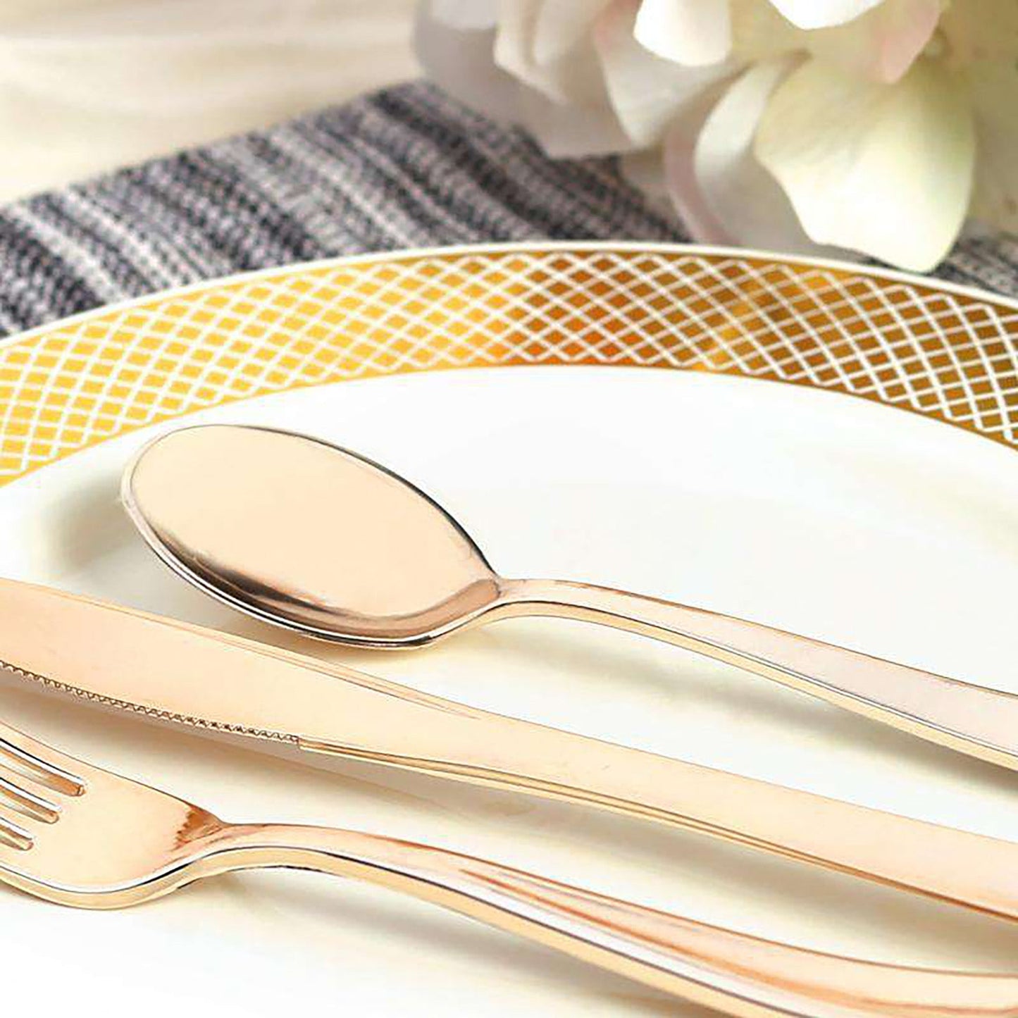 Sturdy metallic gold plastic spoons, 6.25 inches, durable yet lightweight, designed for effortless serving at any occasion.