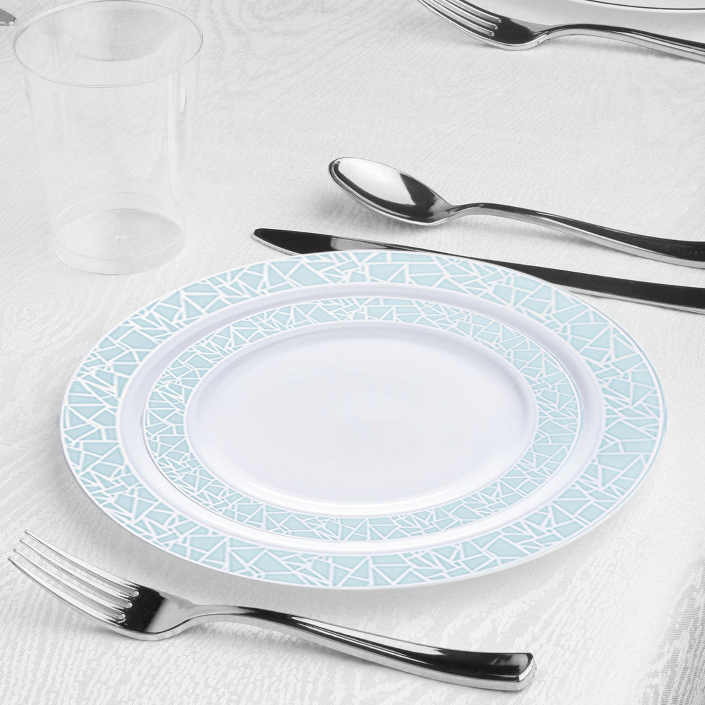 Table Setting: Burgundy disposable tablecloths, navy paper napkins, and clear plastic cups complement the silver cutlery and mosaic-rimmed plates