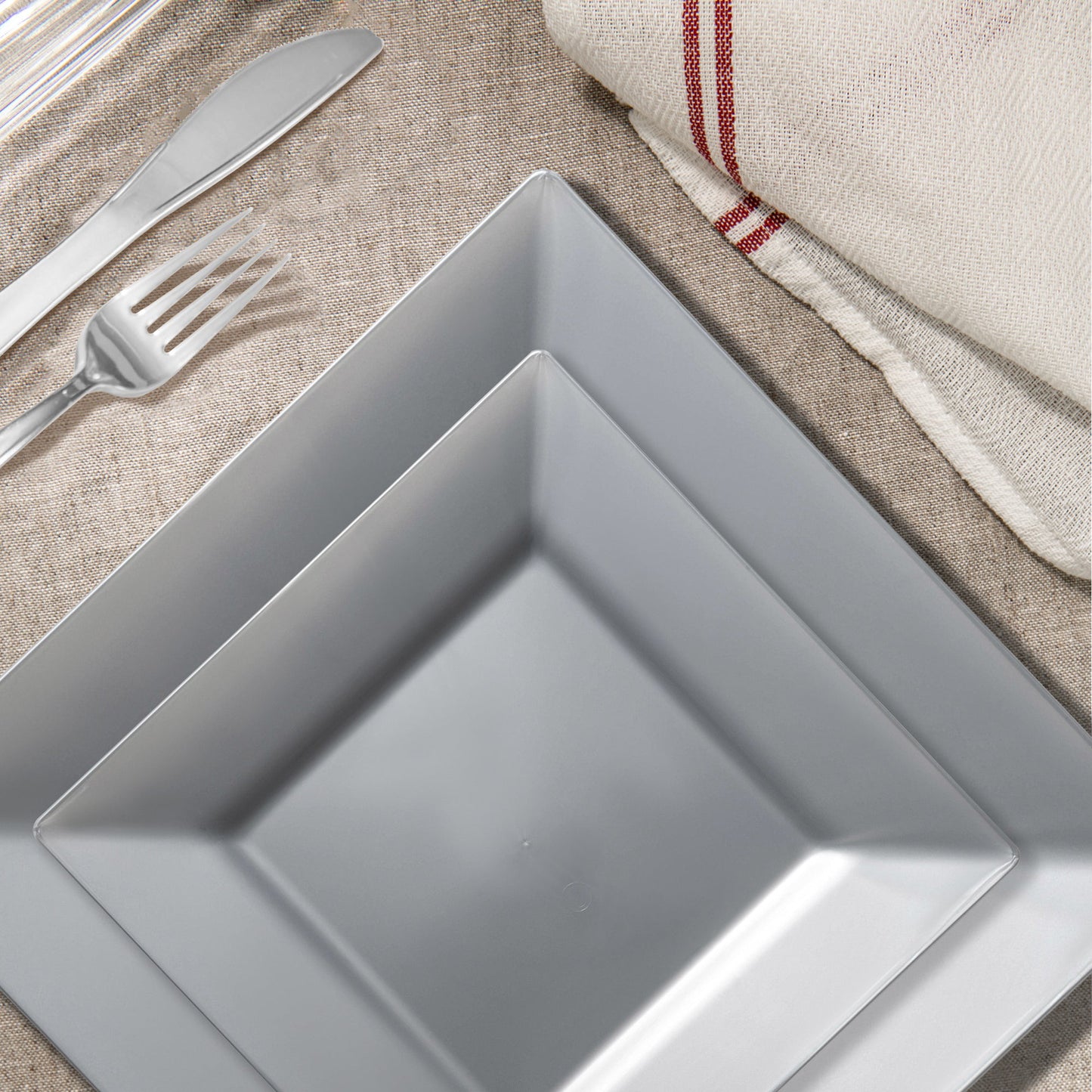 The Silver Square Plastic Wedding Set offers impeccably sized plates and utensils to elevate lavish events and large celebrations