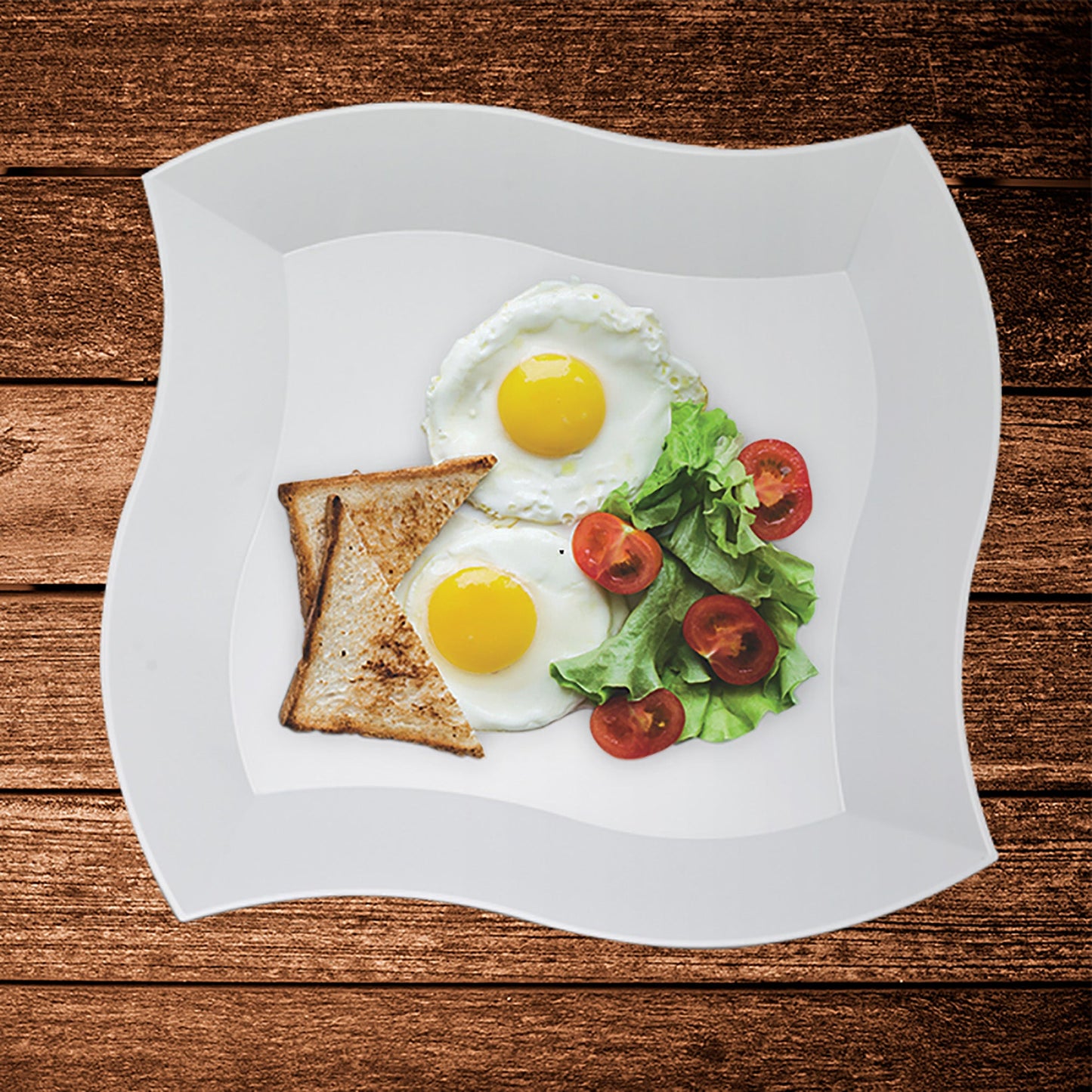 This 240-piece set includes 120 dinner plates and 120 salad plates, each featuring a wavy square design in classic white