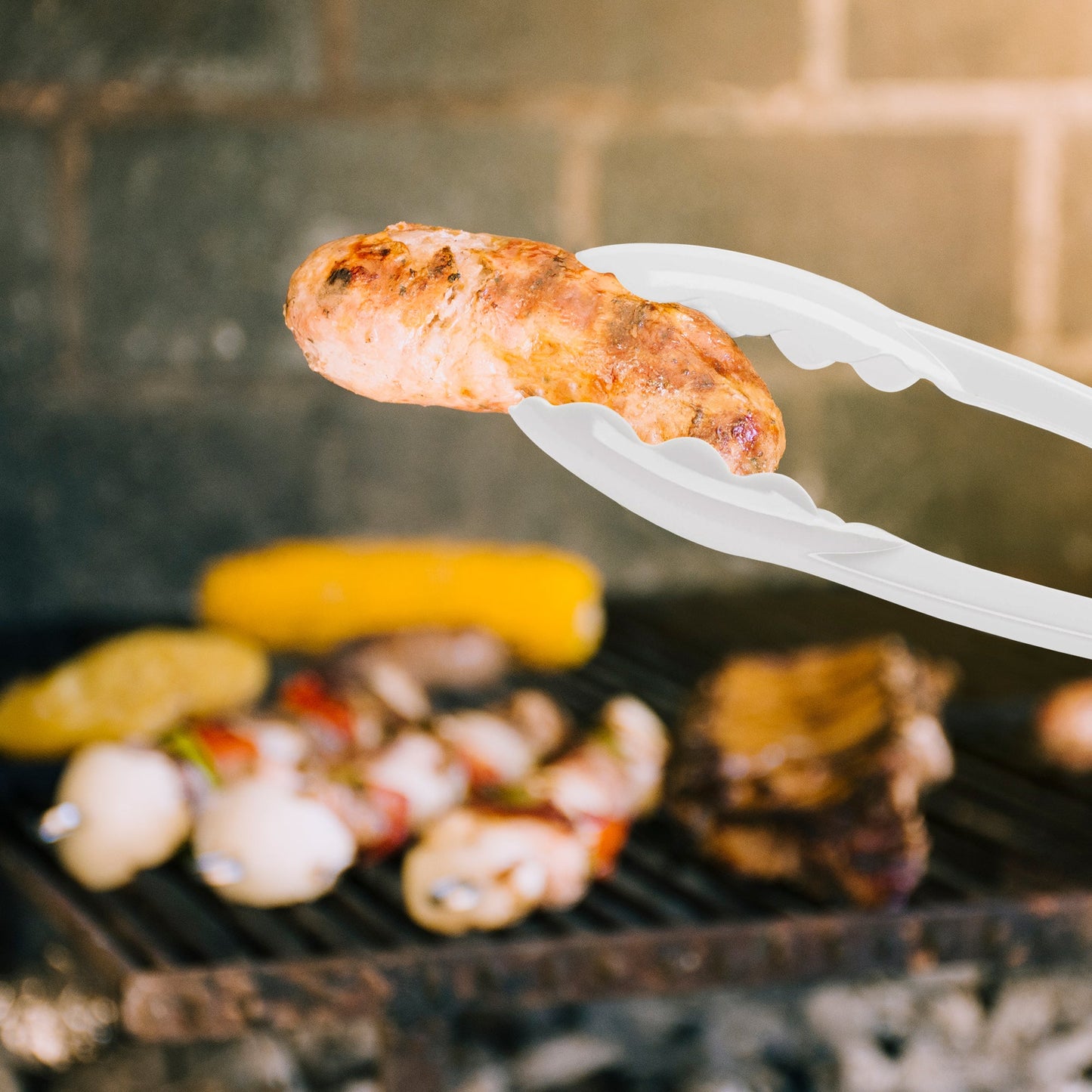 White Plastic Serving Tongs were used to serve salads and pastries at a buffet setup.