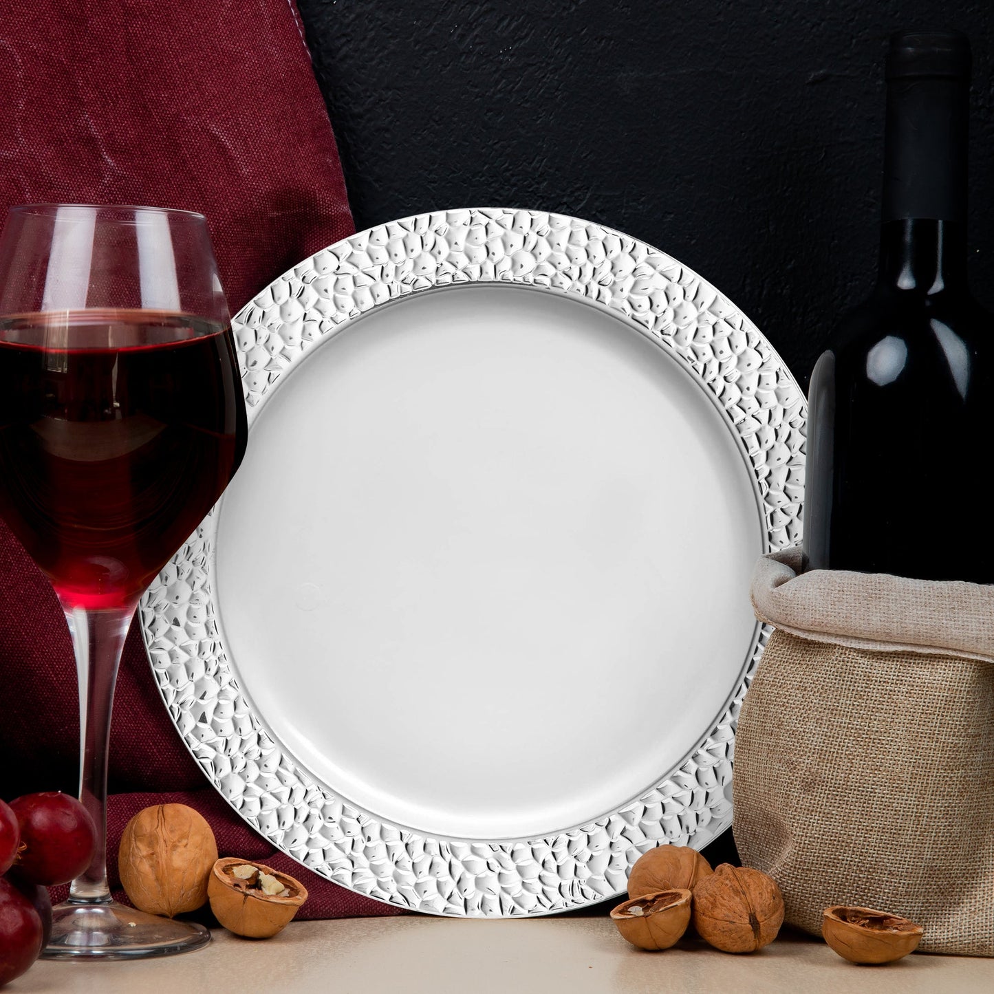 White Salad Plates with a hammered silver rim presented appetizers at a formal reception