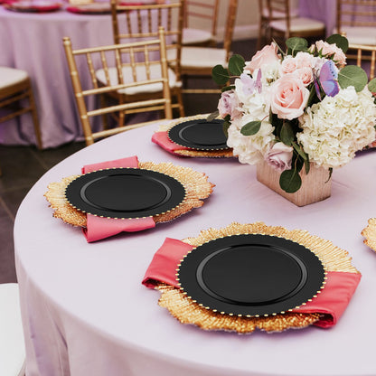 10" black plates with gold trim were used for main dishes during a luxury dinner setup.