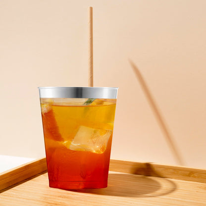 10 oz. Clear Round Tumblers with Metallic Silver Rim displayed on a banquet table with elegant lighting and flowers