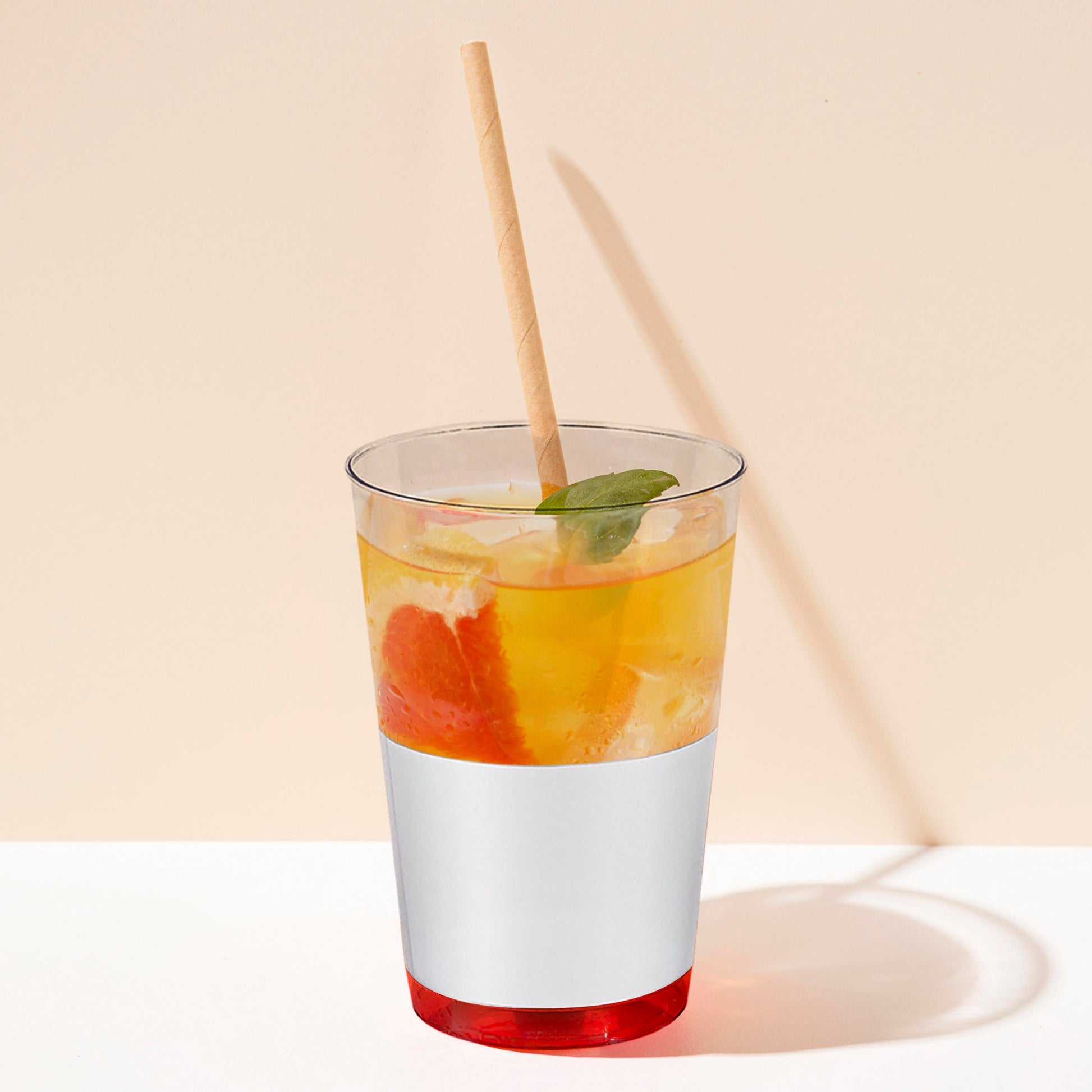 12 oz. Clear Tumblers with metallic silver thick base showcased on a festive drink station