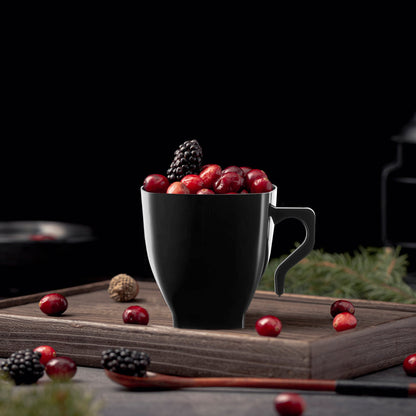 2 oz. Black Square Plastic Mini Coffee Tea Cup filled with cherries, highlighting its bold design and compact size