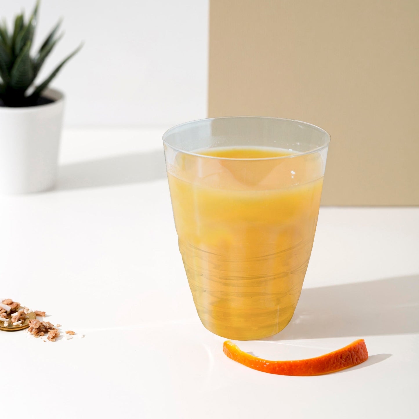 Clear Swirl Plastic Tumblers showcased in a chic buffet setup, perfect for casual refreshments or signature cocktails