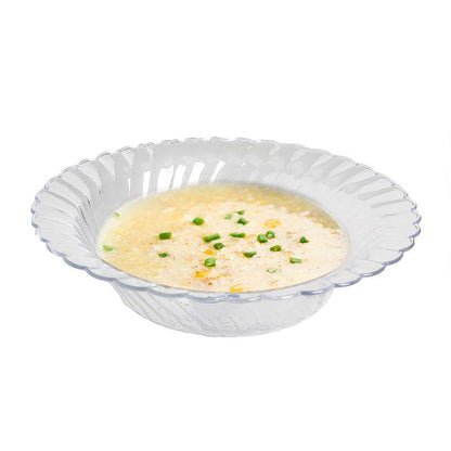 Clear plastic 5 oz. bowls with a decorative flared edge, 5 inches across, disposable and suitable for formal or casual events