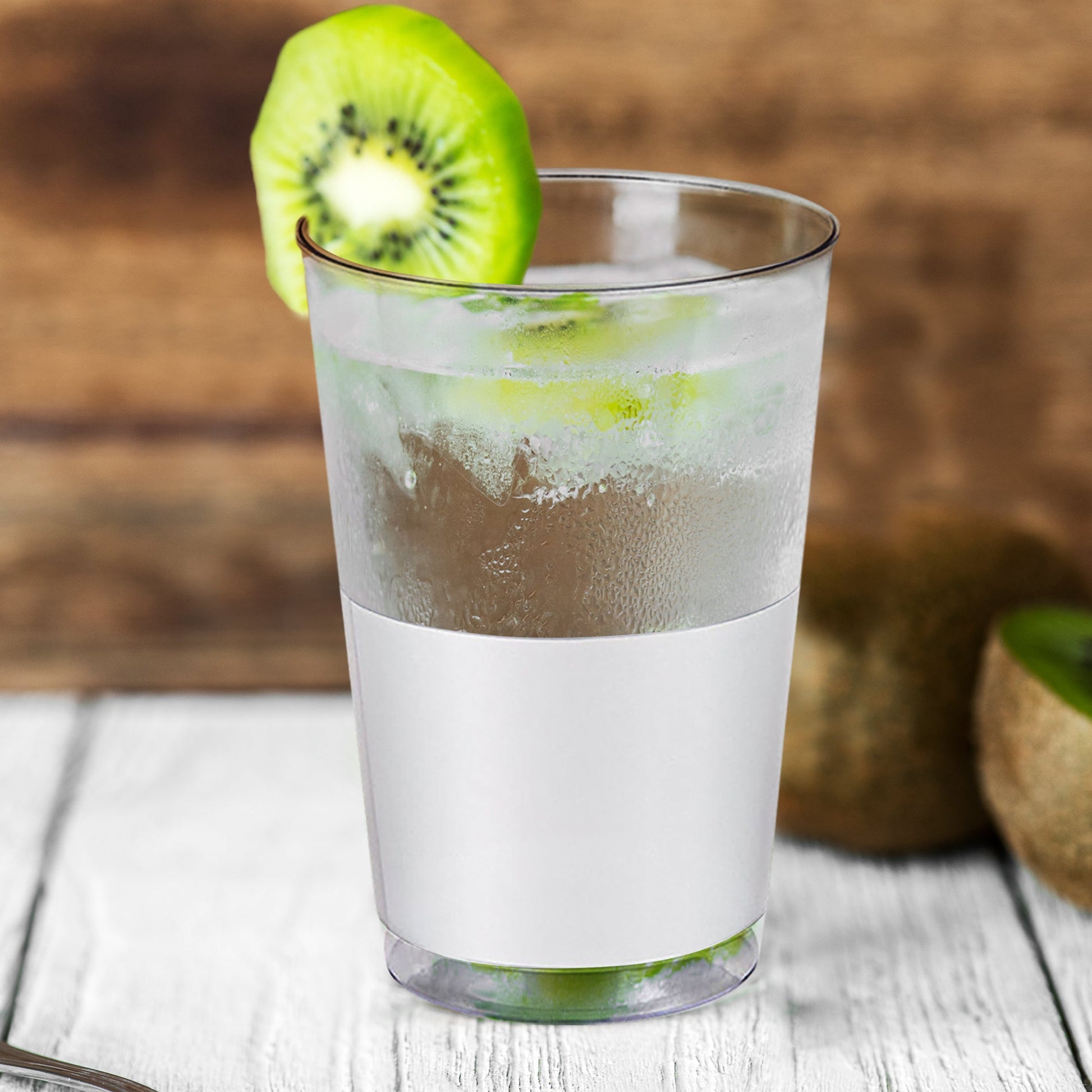 Clear plastic tumblers with bold silver base arranged at a chic event for cold beverages