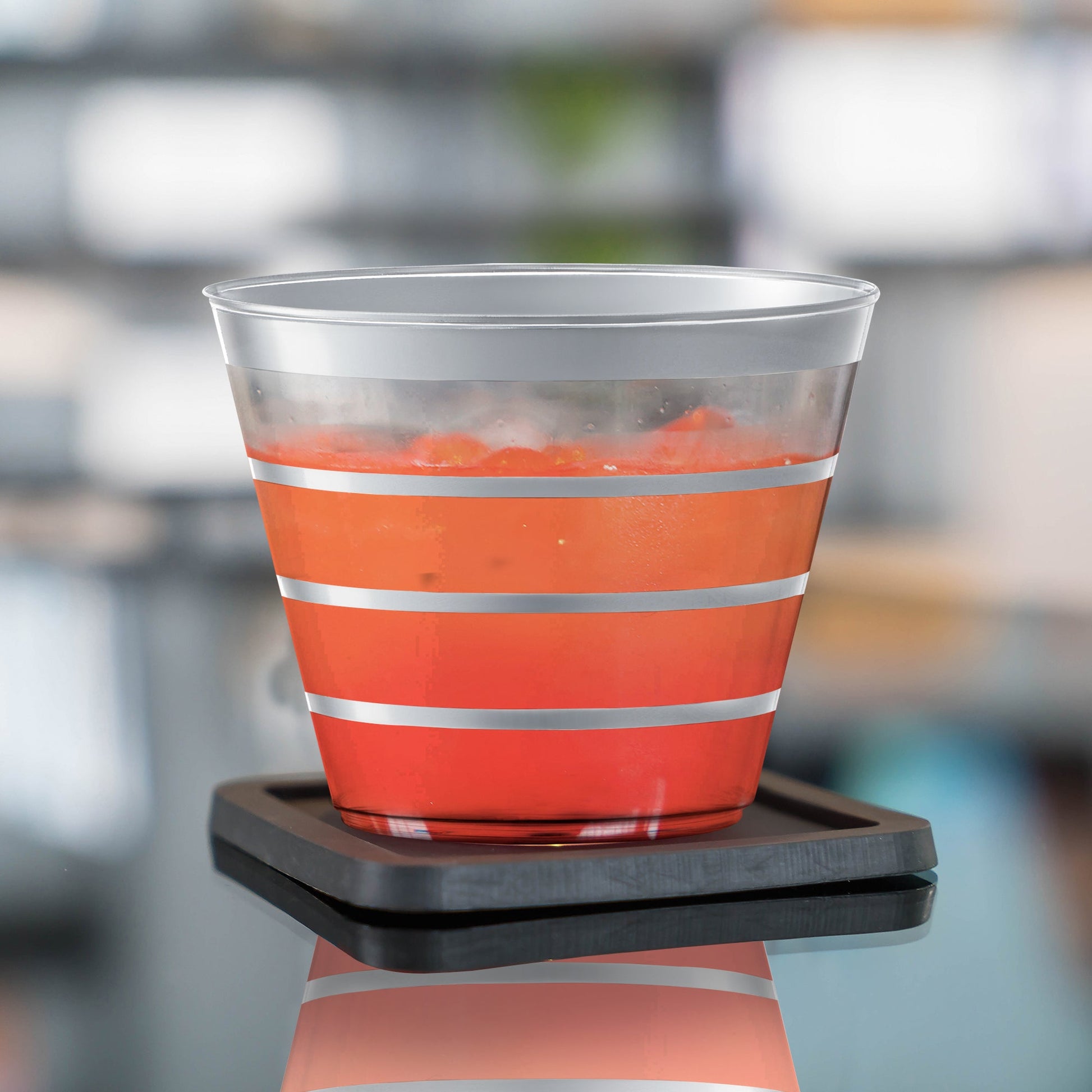 Clear with Silver Stripes Round Disposable Plastic Party Cup featuring a glossy finish and stylish metallic lines