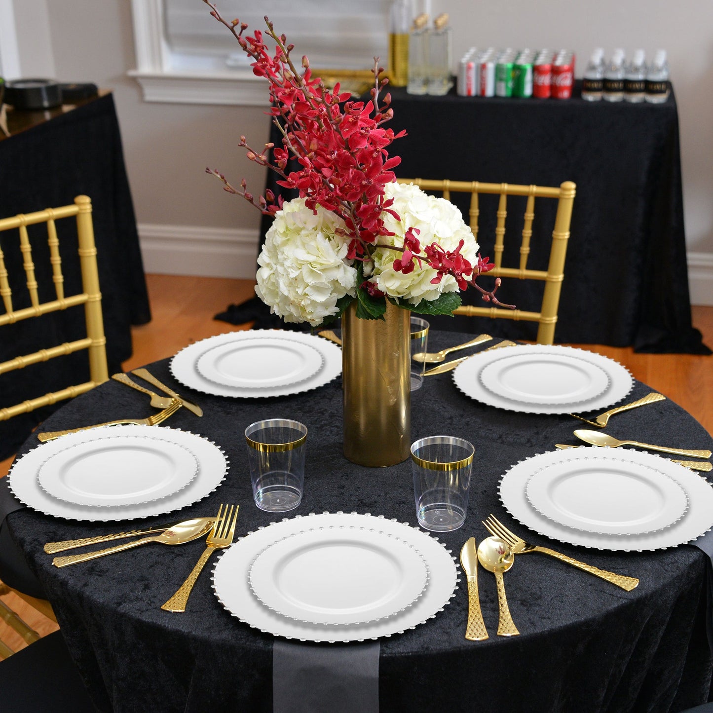 Guests enjoyed formal meals on 10" white plates trimmed with pearl details at a wedding reception.