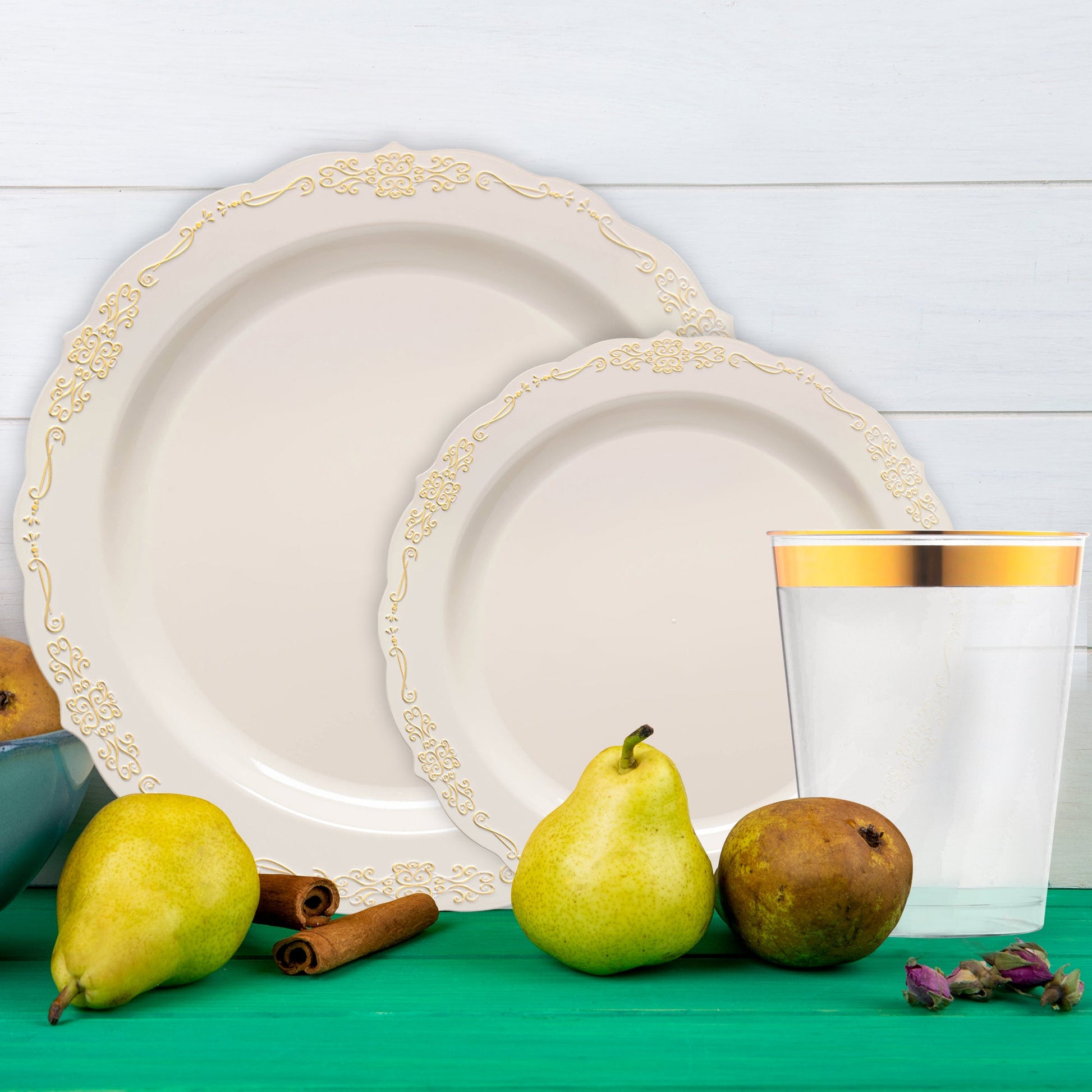 Ivory with Gold Vintage dinnerware placed on a candlelit reception table.