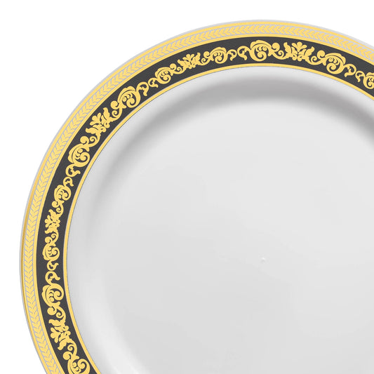 White plastic dinner plates with a black and gold royal rim design