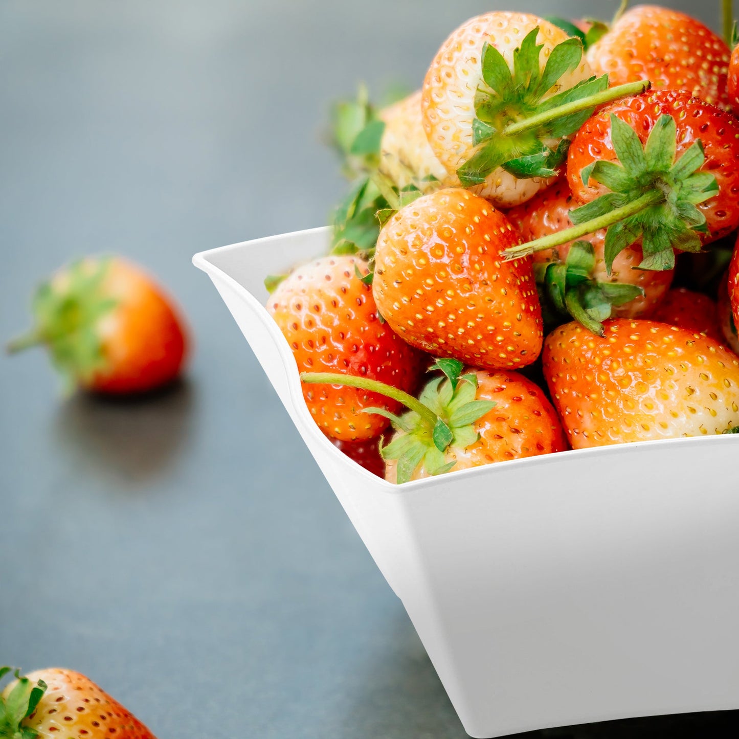 White Wave Plastic Soup Bowl (14 oz.) containing fresh strawberries, showcasing the bowl's versatility